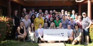 Shenandoah health professions and pharmacy students and faculty gathered around a Shenandoah banner in Nicaragua in 2024.